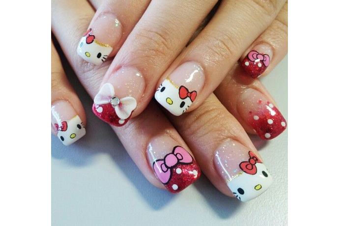 foto de uñas decoradas con estilo hello kitty con moños rosa