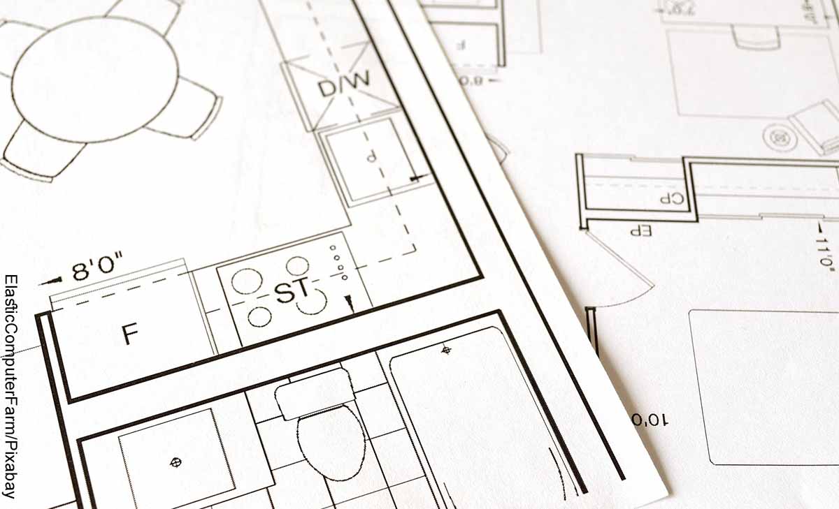 Foto de medidas, líneas y planos en una hoja que muestra cómo hacer un plano de una casa