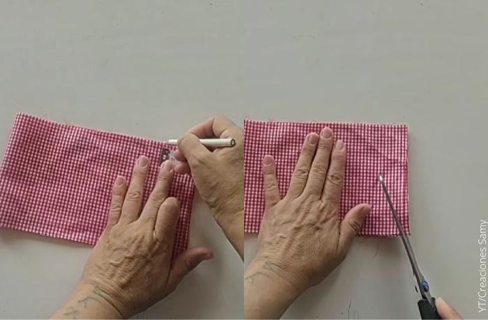 Foto de una mujer cortando una tela