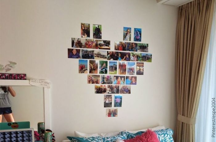 Foto de un corazón hecho con fotos en la pared