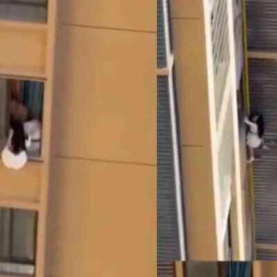 mujer escapo por la ventana de un edificio